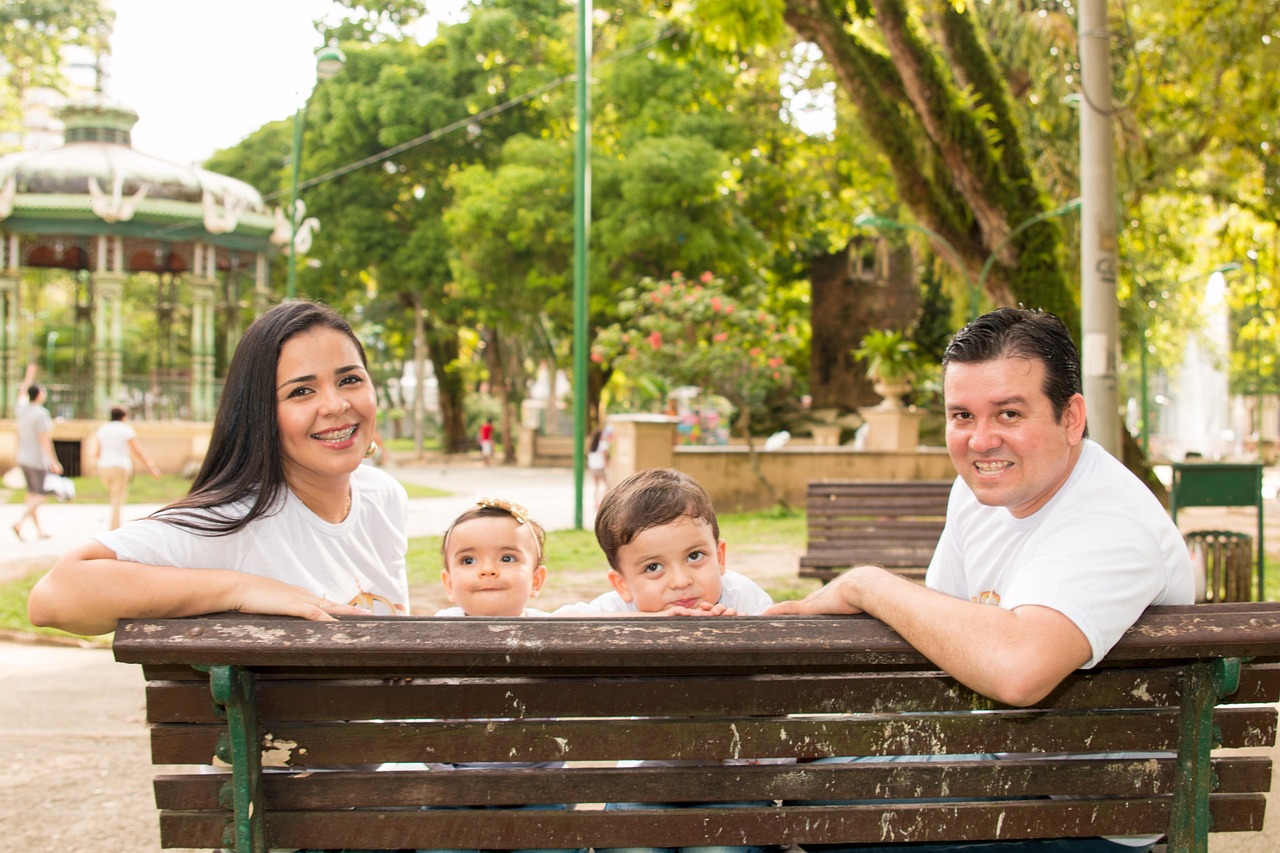 Happy family smiling with thumbs up